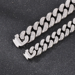 Close-up of hip hop silver Cuban link bracelet featuring shiny pavé crystal rhinestones