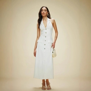 Detail of white halter neck maxi dress with button-down front and backless design