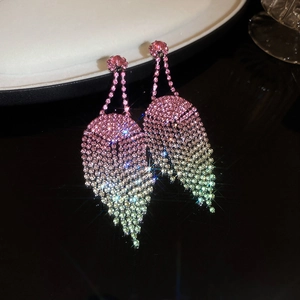 Detail of luxury gradient rhinestone fringe earrings with pink and green crystal stones