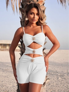 White crinkle one-piece swimsuit with cutout waist and gold sun metal buttons