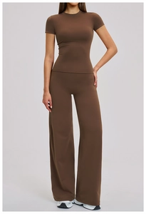 Deep brown yoga set featuring slim short sleeve top and high waist wide leg pants