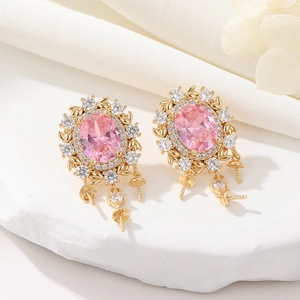 Elegant gold bow earrings with pink oval zircon and long needle pendants on satin cloth