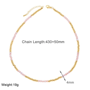Detailed view of pink crystal beaded necklace with gold metal beads and lobster clasp