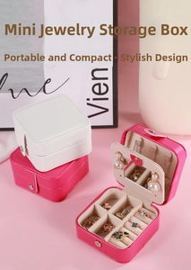 Detail view of mini PU leather jewelry box with mirror and ring slots in white and pink