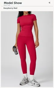 Full body studio shot of raspberry red high waist yoga pants and tight short sleeve top