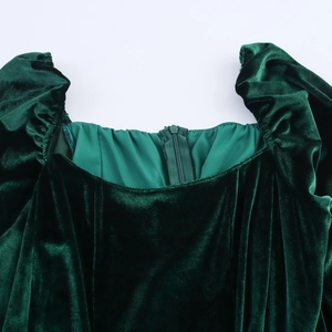 Elegant green velvet dress featuring a square neckline and vintage pleated sleeve details