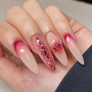 3D gradient Halloween press-on nails with red blood smear and white suture details
