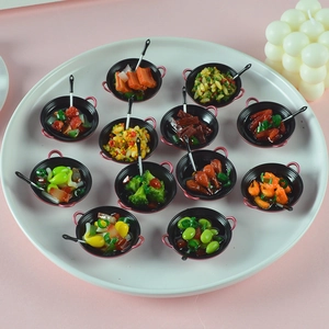 Detailed collection of 11 miniature resin food pans with various faux vegetable dishes