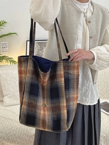 Retro plaid wool tote bag with orange and blue check pattern and gold metal hardware