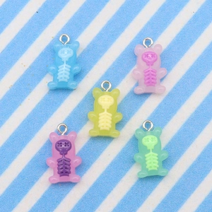 Detailed view of colorful resin bear pendants with skull patterns and metal rings