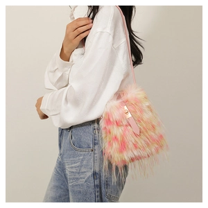 Detail of colorful faux fur shoulder bag with pink strap and golden metal buckle