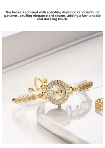 Detail of elegant gold women's watch featuring a crystal-encrusted bezel and champagne dial