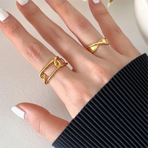 Minimalist gold-tone 925 silver rings with chunky chain and twisted designs on hand