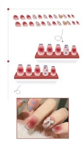 Détail de faux ongles dégradés roses avec nœuds 3D et motifs de cœurs bleus