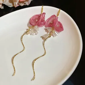 Pink fabric flower and white lily of the valley earrings with long gold tassel and pearls