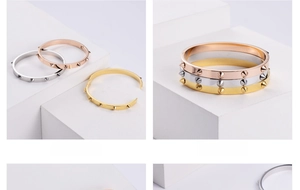 Detailed view of polished stainless steel stud bracelets with secure clasp mechanism