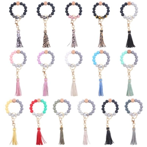 Detailed view showing 15 colorful silicone bead keychains with wooden beads and PU tassels