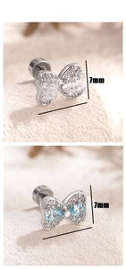 Detail view of titanium steel bow earrings with pink and blue zircons and screw backs