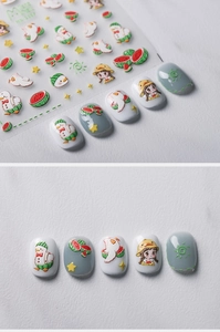 Detail view of 5D embossed summer nail art stickers featuring watermelon and duck patterns