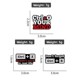 Detailed view of computer shortcut enamel pins with dimensions and weight measurements