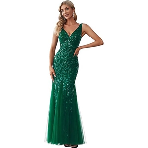 Elegant emerald green V-neck evening gown with shimmering sequins and tulle fishtail hem