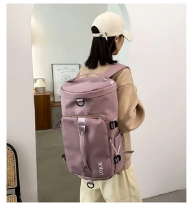 Detail view of pink purple multi-functional travel backpack with adjustable straps