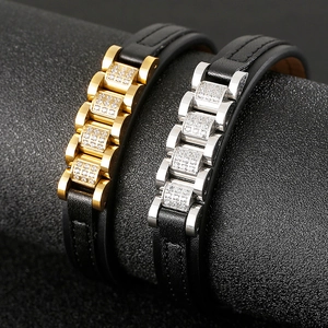 Detailed macro view of CNC set cubic zirconia on leather and gold stainless steel straps