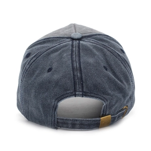 Detail of adjustable metal buckle and vintage washed texture on baseball cap back