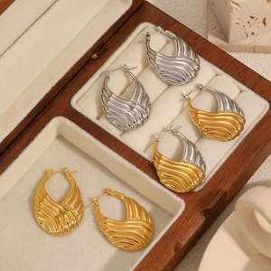 Three pairs of U-shaped stainless steel earrings with wavy texture in gold and silver