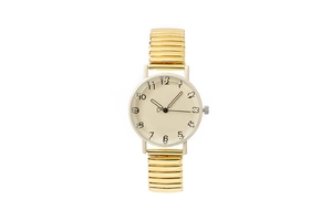 Detailed macro view of vintage gold stretch strap and creamy dial with artistic numerals