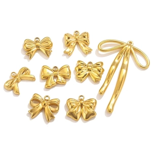 Selection of golden stainless steel bow charms and tassel pendants for DIY jewelry