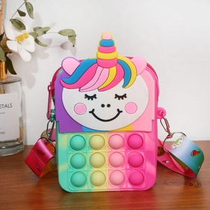 Close-up of rainbow unicorn pop fidget crossbody bag with soft silicone bubbles