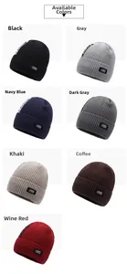 Grid view showing seven colors of thick ribbed knit beanies with woven logo labels
