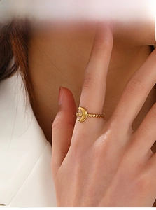 Detail of 18K gold plated stainless steel crescent moon ring with beaded texture band