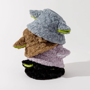 Close-up of plush bucket hats with cartoon ears and green satin lining detail