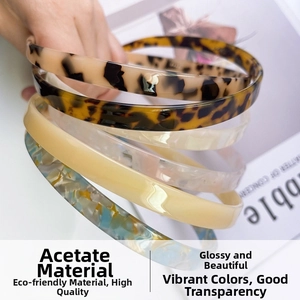 Detailed close-up of premium acetate hairbands with leopard print and floral patterns