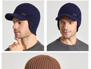 Detail of knit winter hat showing the warm ribbed texture and silver JEANS metal badge