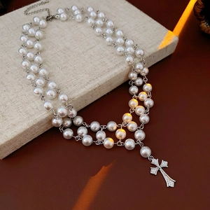 Three-layer pearl necklace with a sparkling crystal-encrusted cross pendant for women