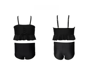 Front and back view of girls' black two-piece swimsuit with ruffled hem and lace-up detail