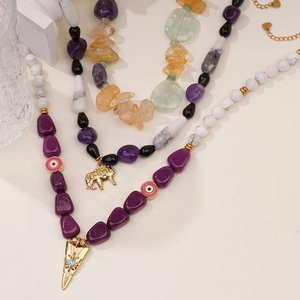 Multilayer gemstone beaded necklace featuring gold elephant and evil eye charms