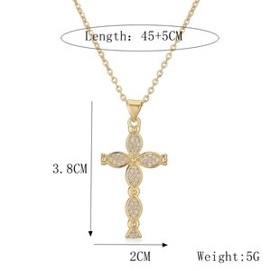 Detail showing cross pendant dimensions 3.8cm height and 2cm width with tiny cubic zirconia