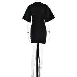 Detail view of the back zipper and long trailing sash on this black mini dress