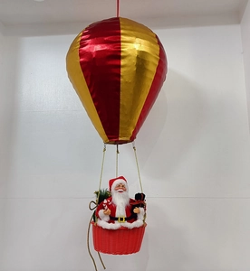 Detail of Santa Claus in red weave basket hanging from a red and gold hot air balloon