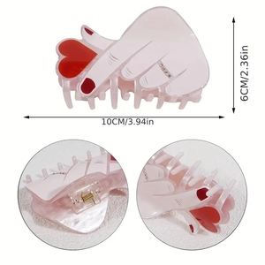 White palm-shaped hair claw with red heart and rhinestones, 10cm size view