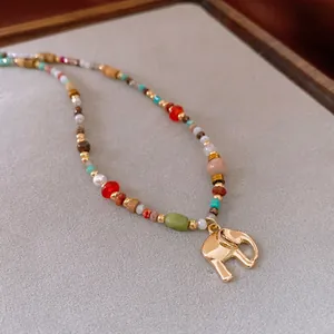 Vintage elephant charm necklace with colorful jasper beads and a gold-plated pendant