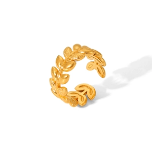 Detail of gold olive leaf ring showing intricate metal texture and open band design