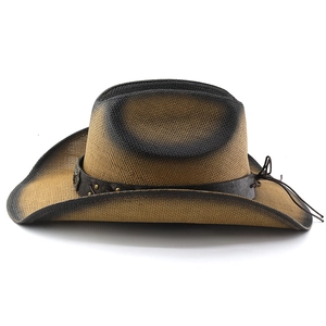 Close-up of woven straw cowboy hat with gradient brim and brown leather band detail