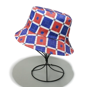 Detailed close-up of a blue red and white geometric bucket hat with national emblems