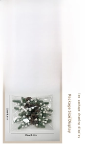Macro view of Christmas pine needle picks with berries and natural pinecones