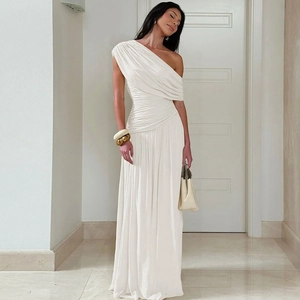 Detail of white one-shoulder dress showing elegant ruched pleats and silky drape fabric